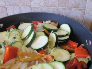 in the pan, add courgettes